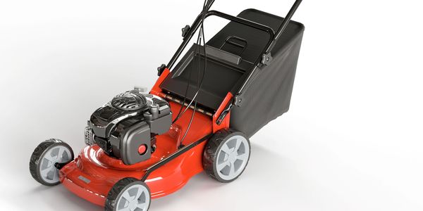 Red and black gas-powered lawn mower with grass catcher bag.