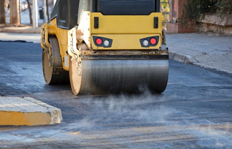 machines for construction of roads and asphalt tracks