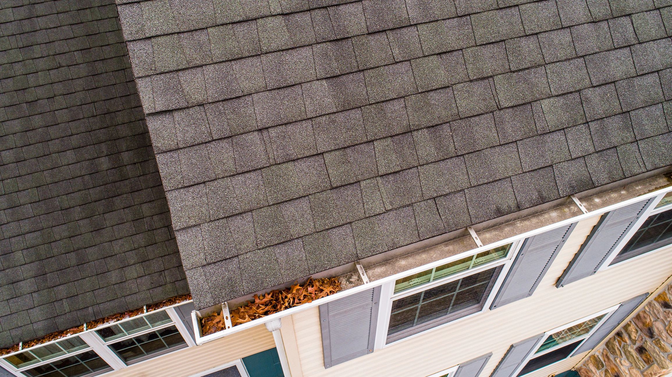 Before and after gutter cleaning. Get your gutters flowing again with Maine Flow Tech.