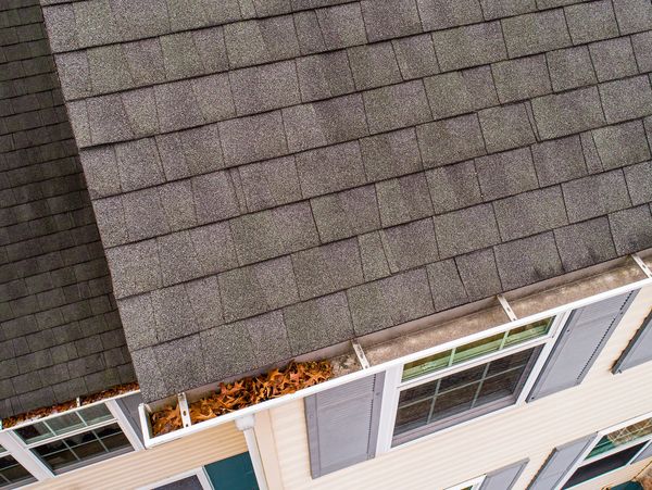 Drone roof inspection showing a damage to rough tiles and gutter
