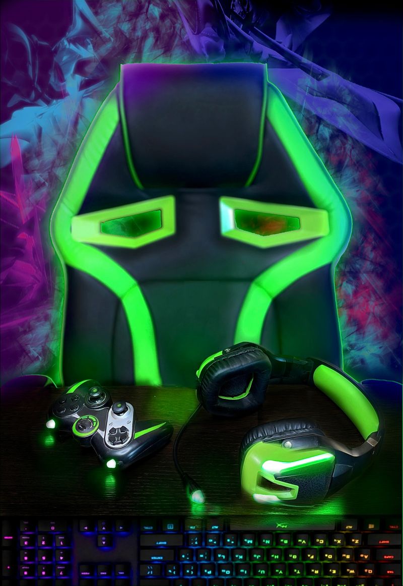 A gaming place for a gamer. It has a gaming chair, gaming gamepad, gaming keyboard, gaming accessories.