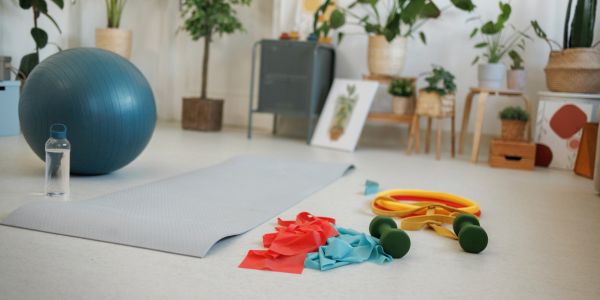 Workout space with exercise ball and resistance bands.