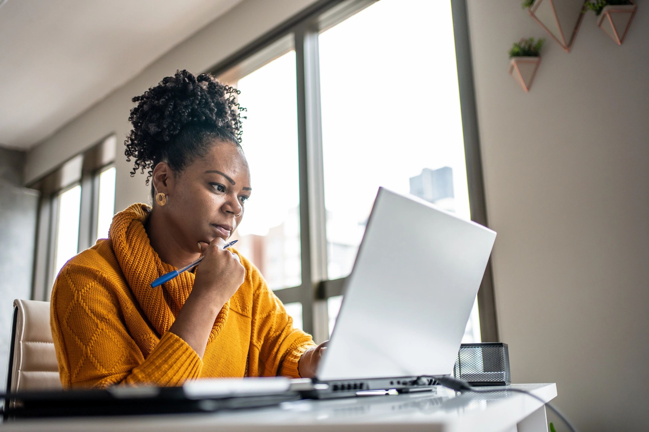 Business professional working independently on a laptop.