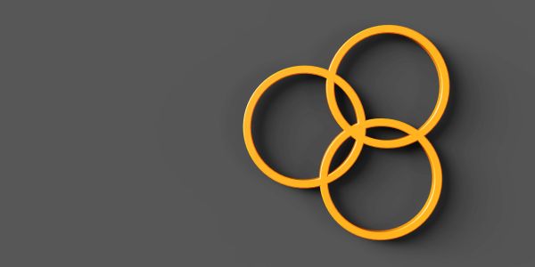 Three interlocking yellow rings on a gray background.