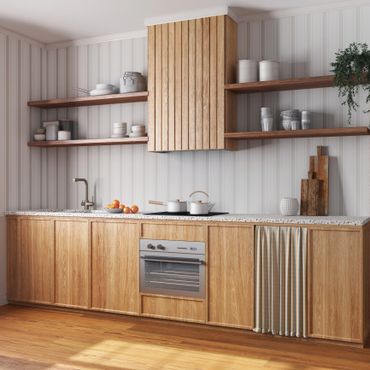 Modern kitchen with wooden cabinets, open shelves, and terrazzo countertop.