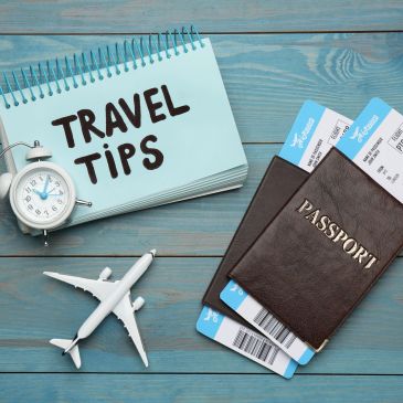 Travel essentials including passport, plane tickets, and travel tips.