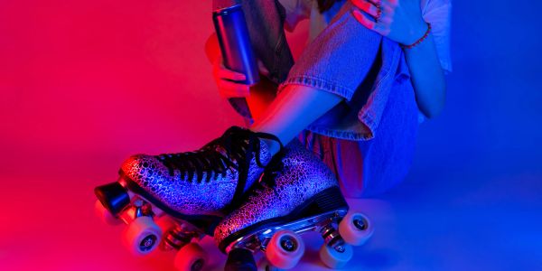 Person wearing leopard print roller skates.