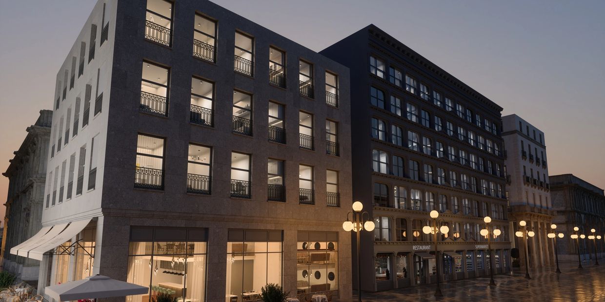 Modern buildings with illuminated windows on a rainy evening.