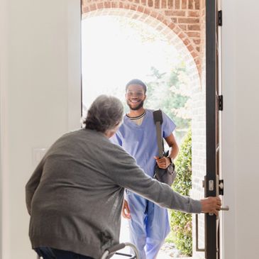 Healthcare worker arrives at an elderly person's home for a visit.