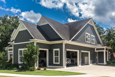 Modern gray house with a three-car garage.