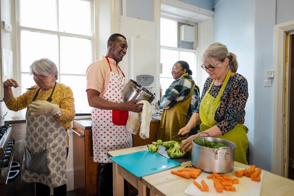 Group of volunteers cooking dinner
