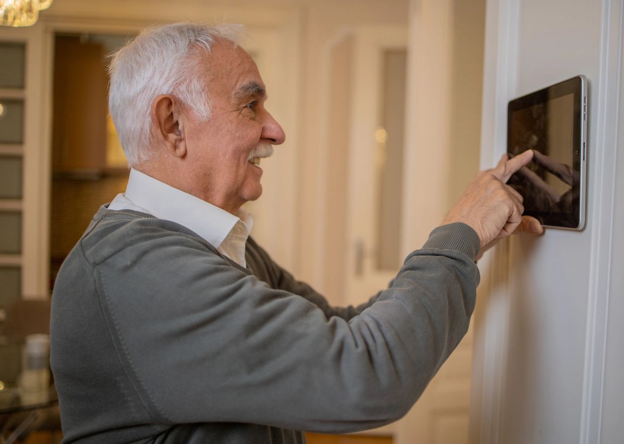 Smart home device with safety message from Thriving Well at Home.