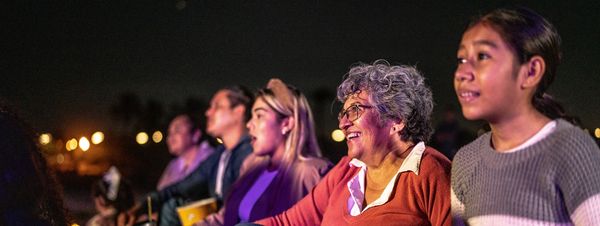 Children and family enjoying a performance.