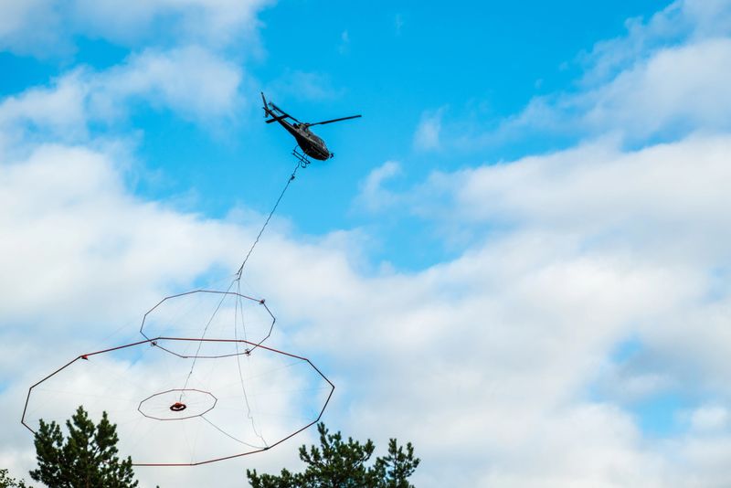 Helicopter with a special instrument searches for minerals from the air, photo from Vasternorrland Sweden.