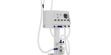 A white medical ventilator machine with tubes and control panel.