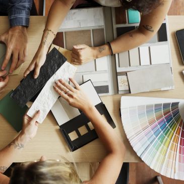 People choosing color samples and materials for design.