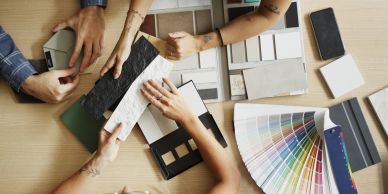 People selecting color and texture samples for interior design.