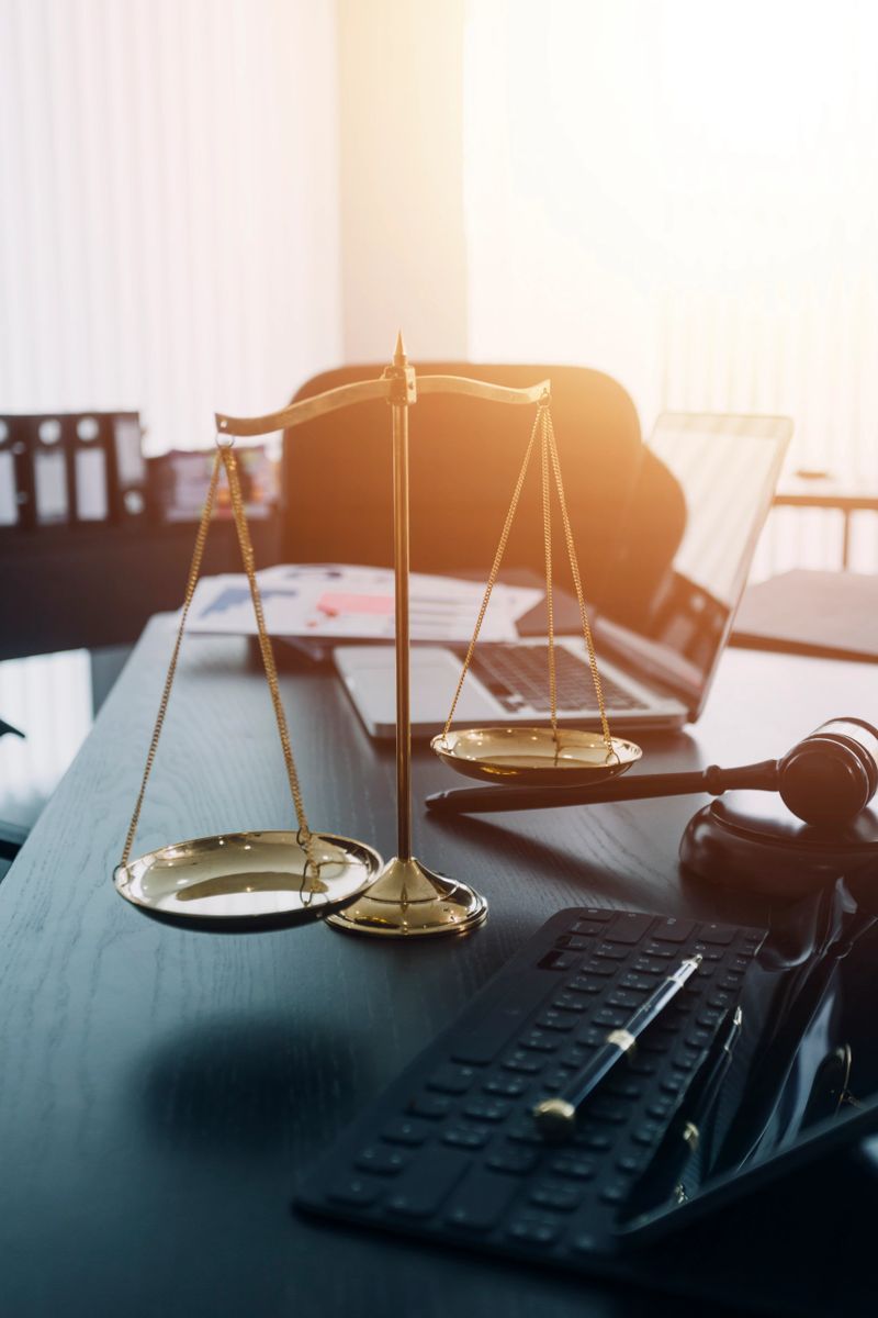 Justice and law concept. Gavel on sounding block in hand's Male judge at a courtroom, working with document law books, report the case on table in modern office.