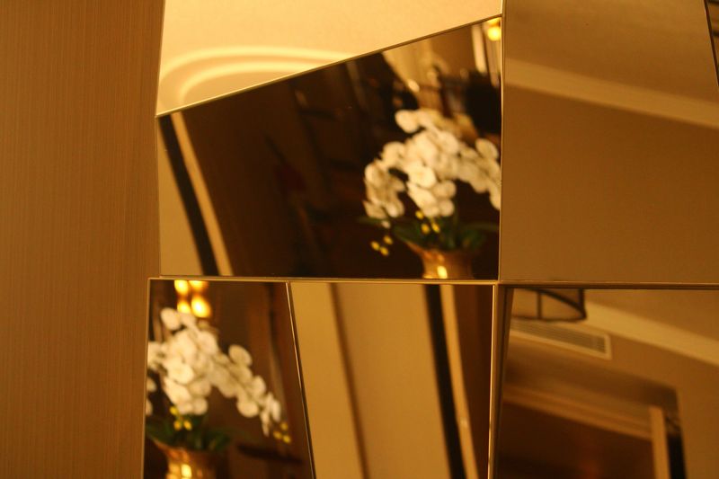 Framed Mirrors Showing the Reflection of White Orchids