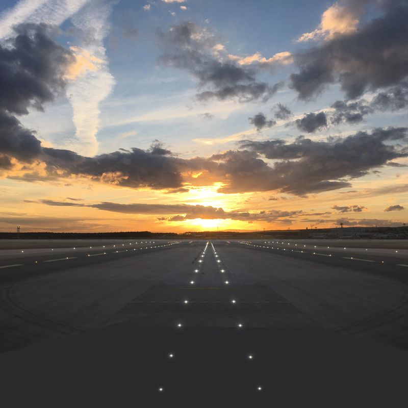 Airport runway takeoff sunset travel