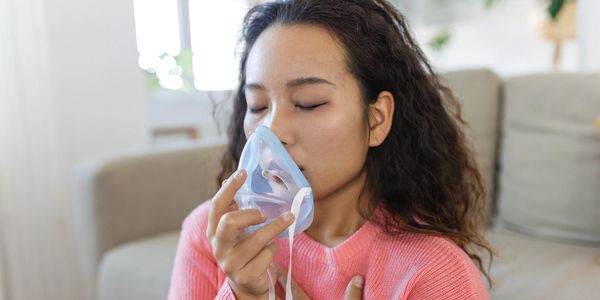 Woman wearing oxygen mask