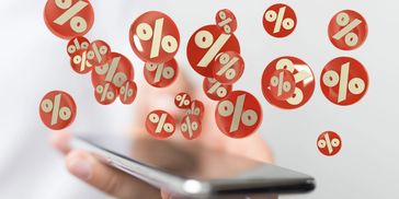 A man hold the mobile with digital screen