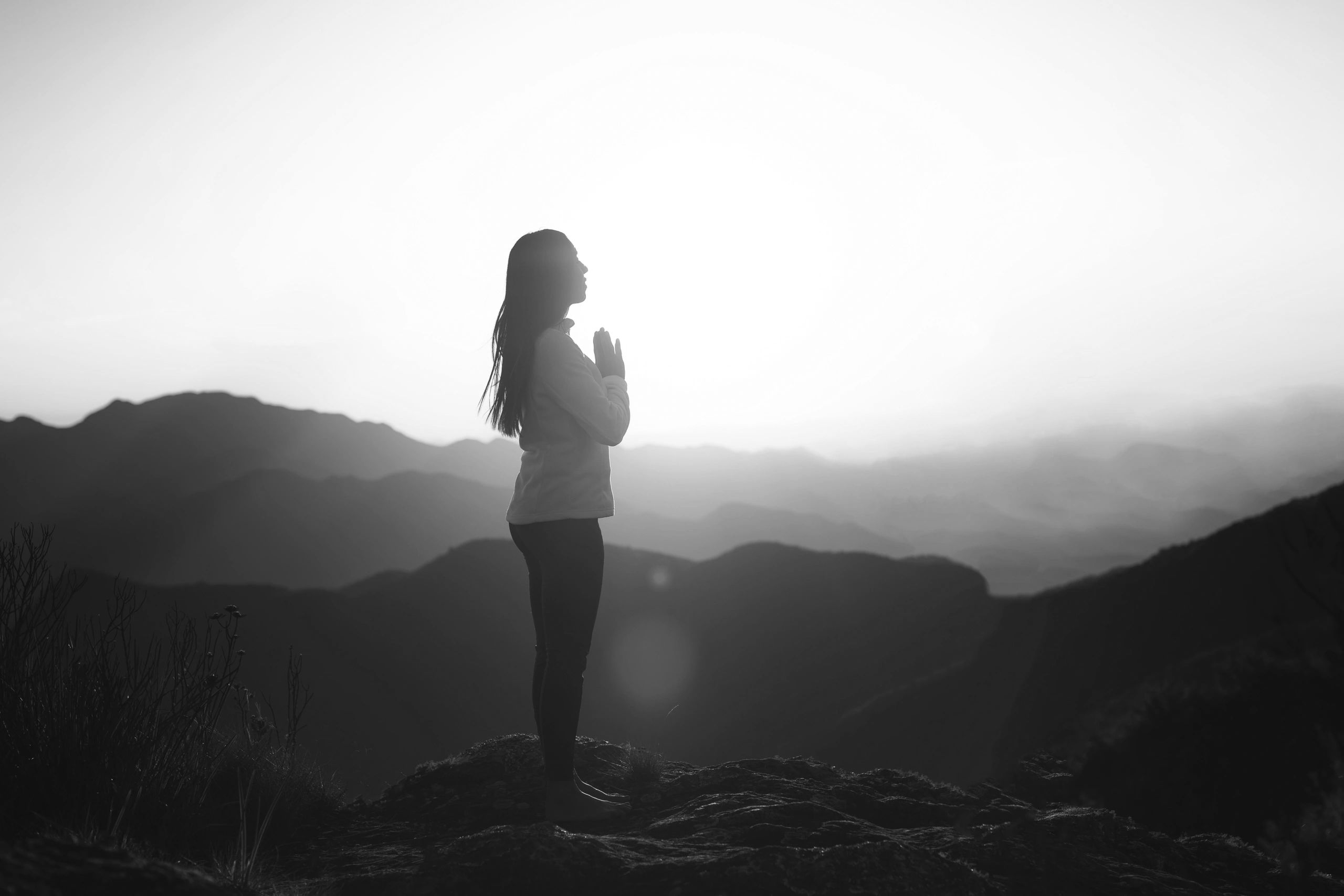 Woman practicing a gentle yoga pose, representing calm, body awareness, and somatic healing