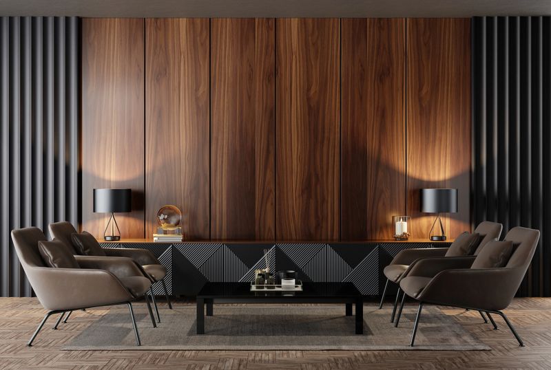 Luxury living room interior with modern leather armchairs and shine small table.  Luxury interior concept. Wood wall paneling. 3d rendering.