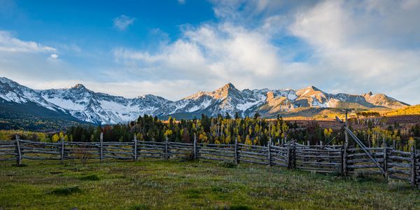 Colorado mountain acreage and open pasture representing rural land opportunities