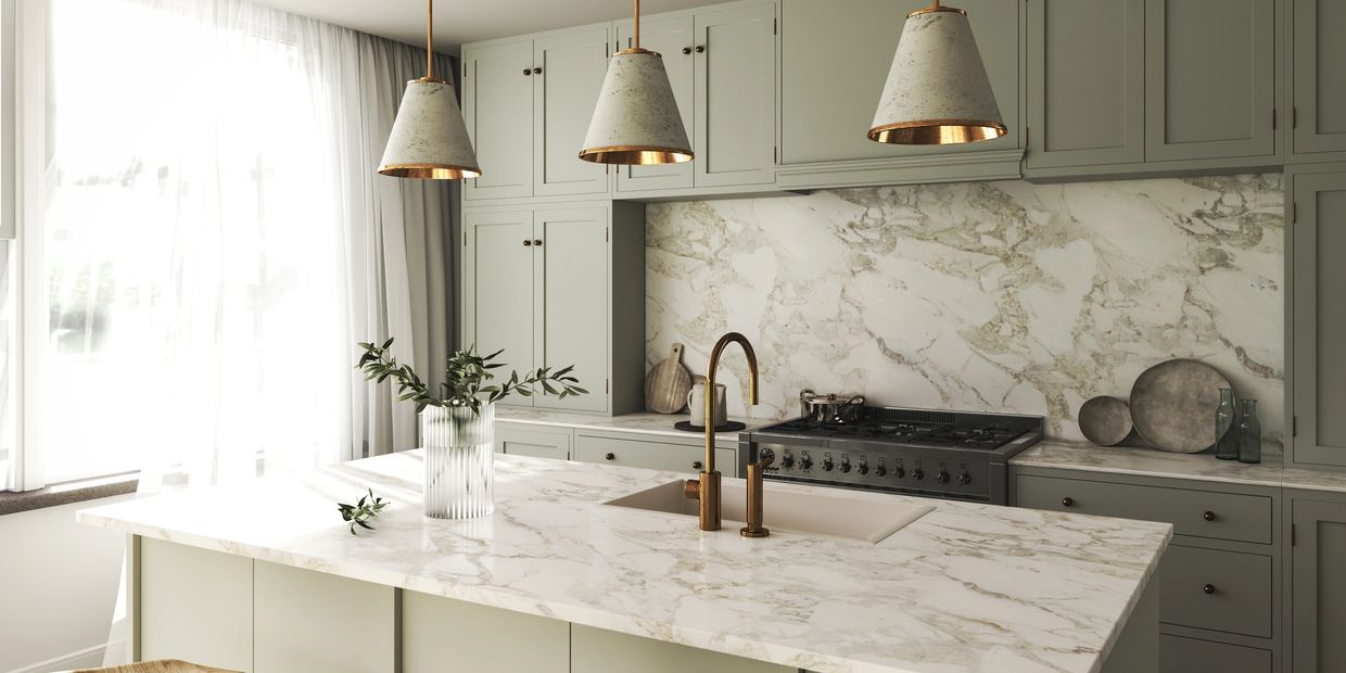 Sage green cabinets, white and green marbled countertop.