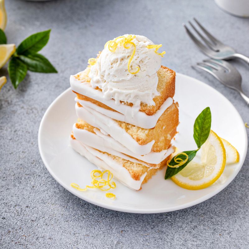 Lemon pound cake frreshly baked with lemon sugar glaze served with ice cream