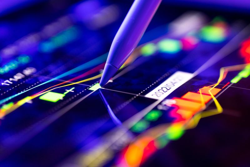 Person analyzing the market trends on a digital screen