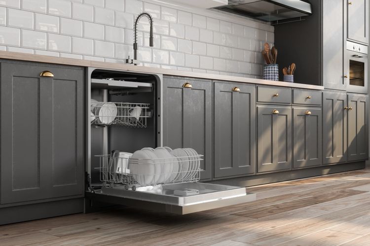 Modern kitchen with an open dishwasher filled with dishes.