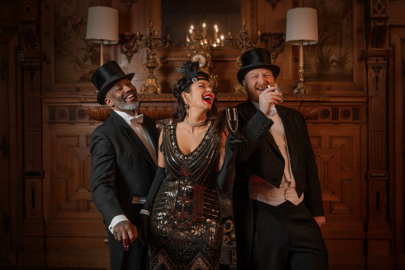 1920s style male and female friends in a luxury stately home setting