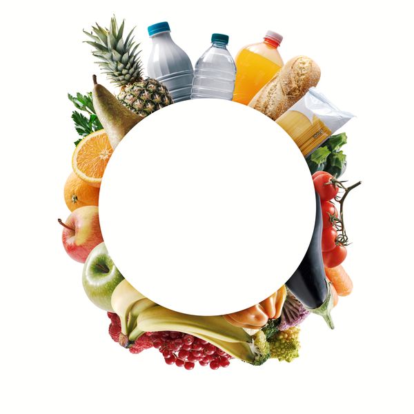 A circular frame of assorted fruits and vegetables with a blank center.