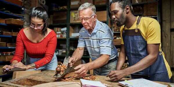 Three people working together