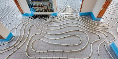 Underfloor heating pipes being installed.
