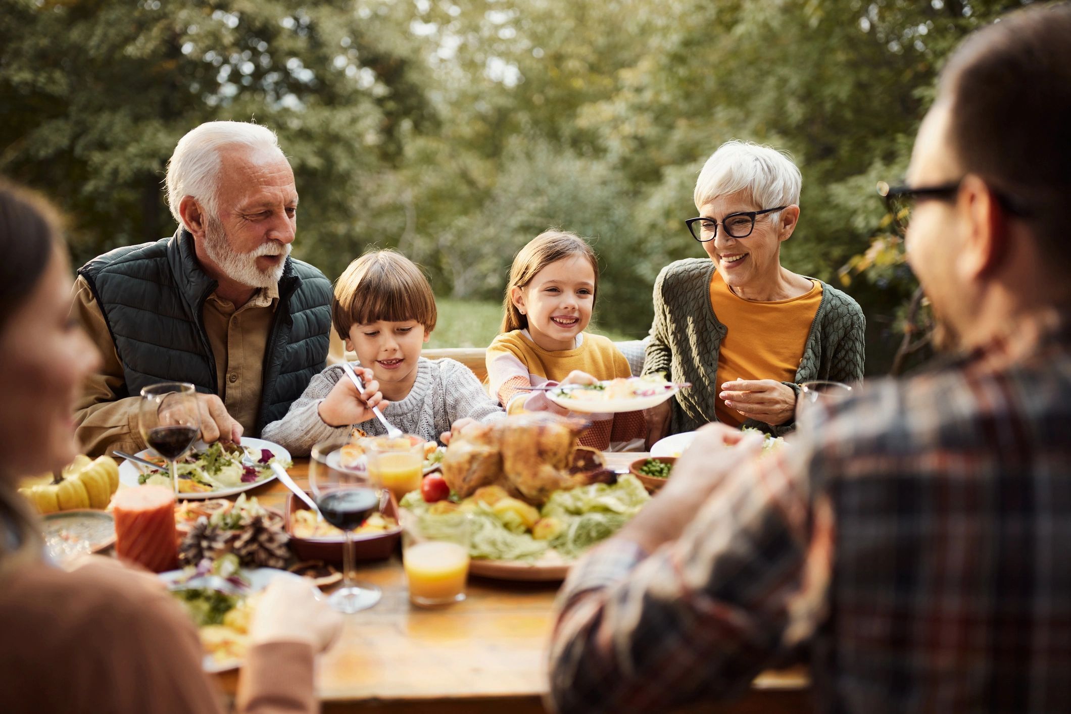 Three generations of a family gathering together, representing Inheritance Tax planning, family weal
