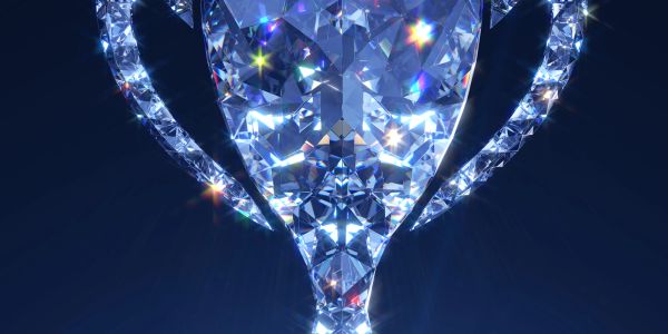 Close-up of a sparkling diamond with intricate facets and reflections.