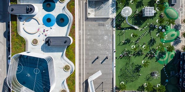 overhead view of urban space with parks and sports amenities. 