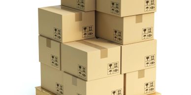Stack of cardboard boxes on a wooden pallet.