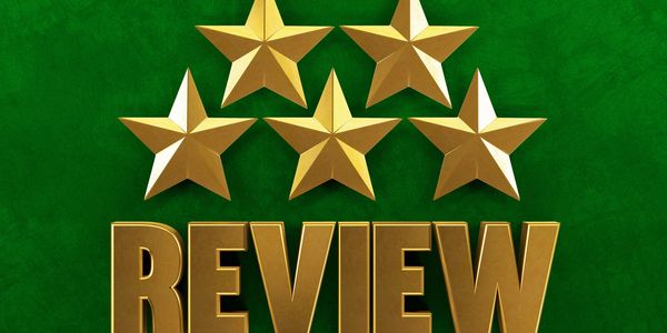 Five golden stars above the word REVIEW on a green background.