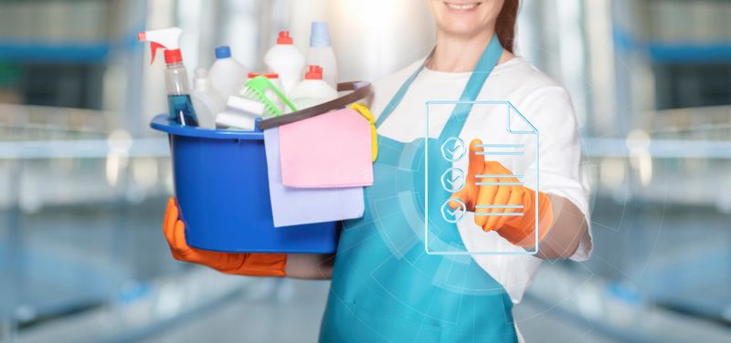 Cleaner clicks on checklist icon on virtual computer screen.
