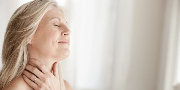 Peaceful middle-aged woman enjoying a moment of relaxation.