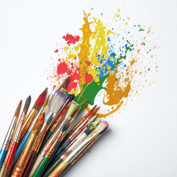 Paintbrushes with colorful paint splashes.