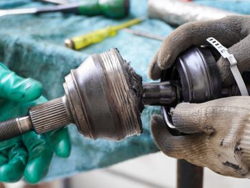 CV axle joint and suspension repair for vehicle