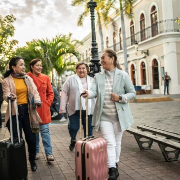 Womens group smiling and enjoying traveling together within a small group tour.