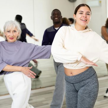 Group dance class with diverse participants.
