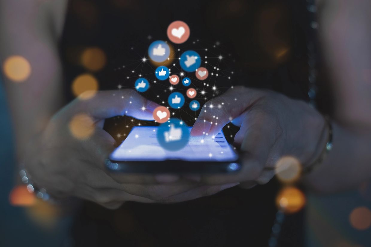 NYC CPA styled as a financial influencer using smartphone to engage followers with floating icons 

