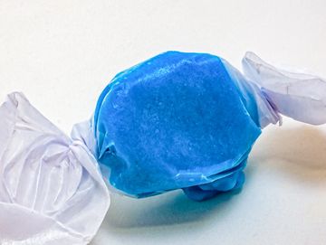 Blue candy wrapped in clear plastic.